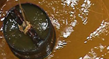 Solution for treating alum-contaminated water